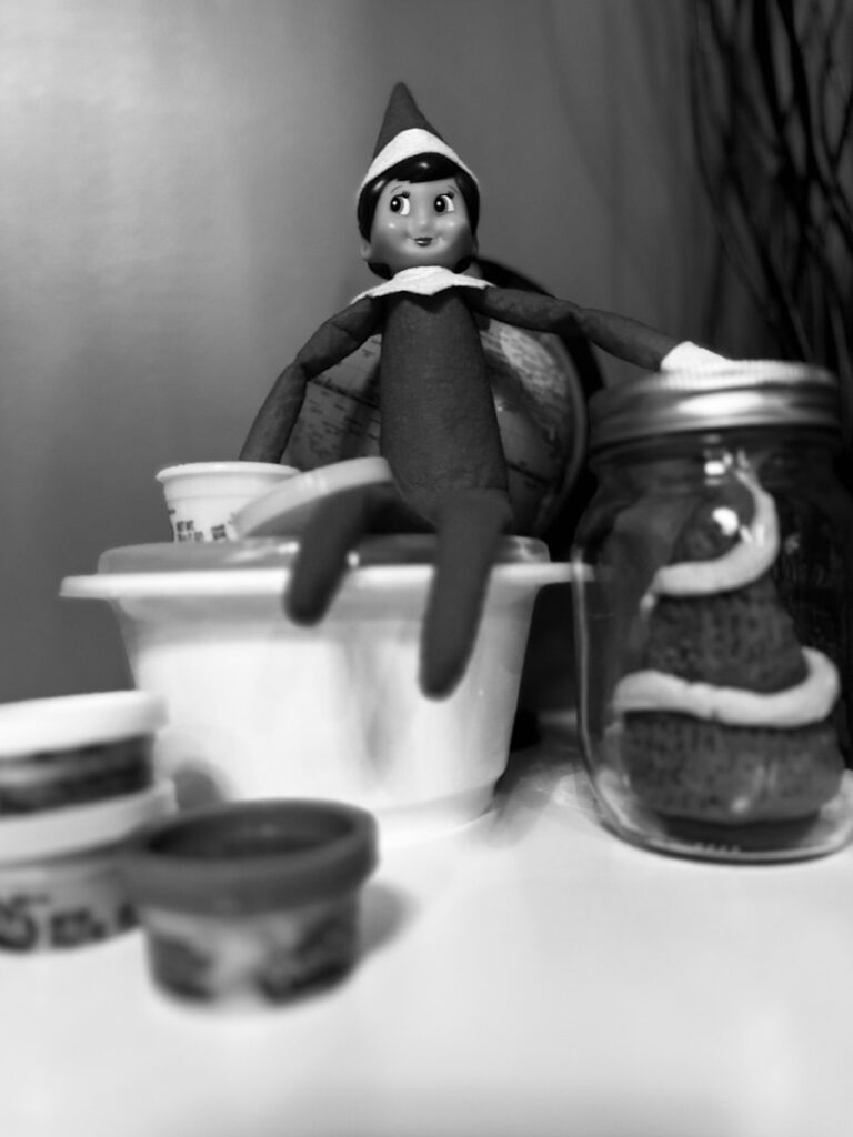 a black and white photo of a cat in the hat